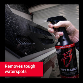Boat Bling being wiped away to reveal a streak-free finish and added wax protection