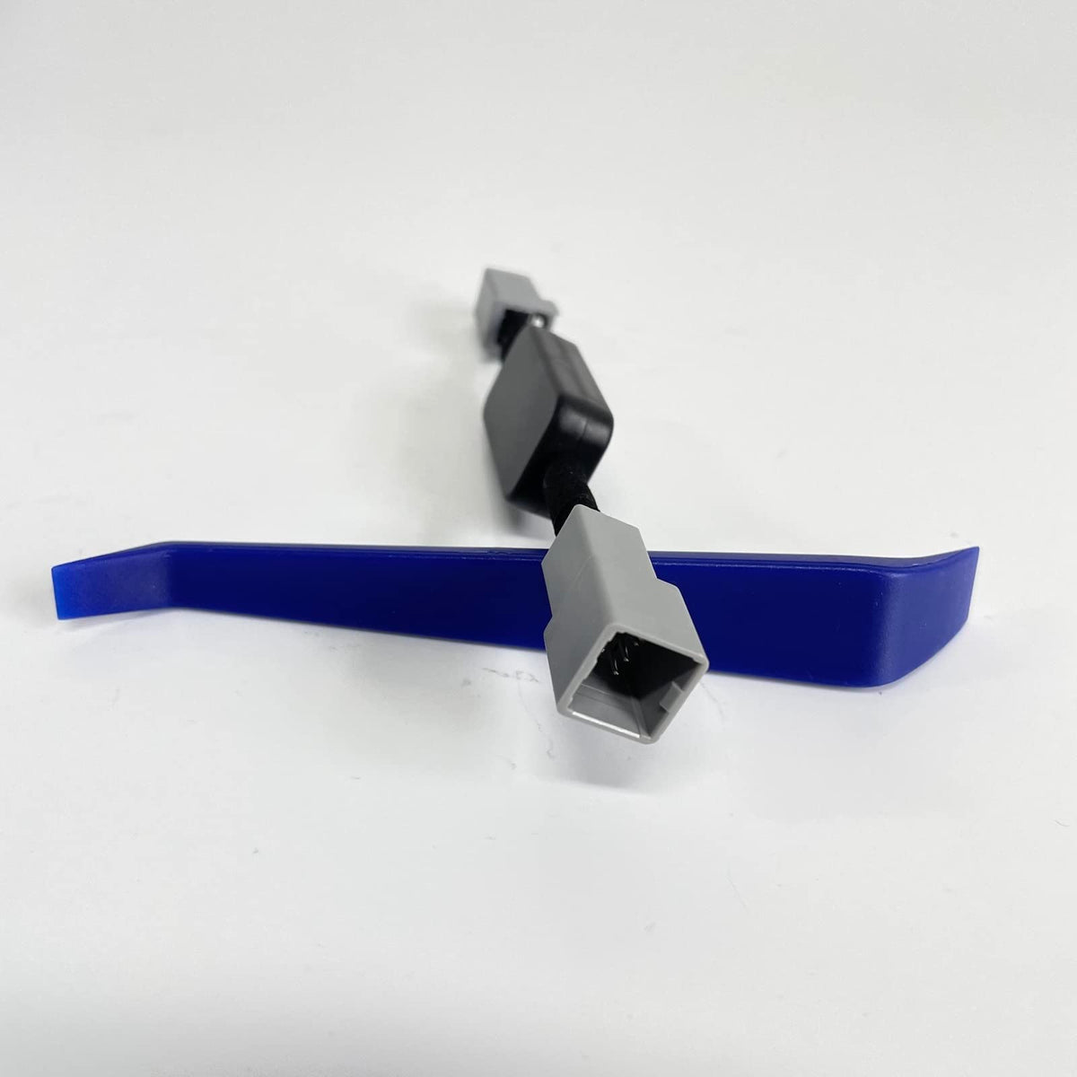 BODENLA cable beside coin showing compact size and easy concealment benefit