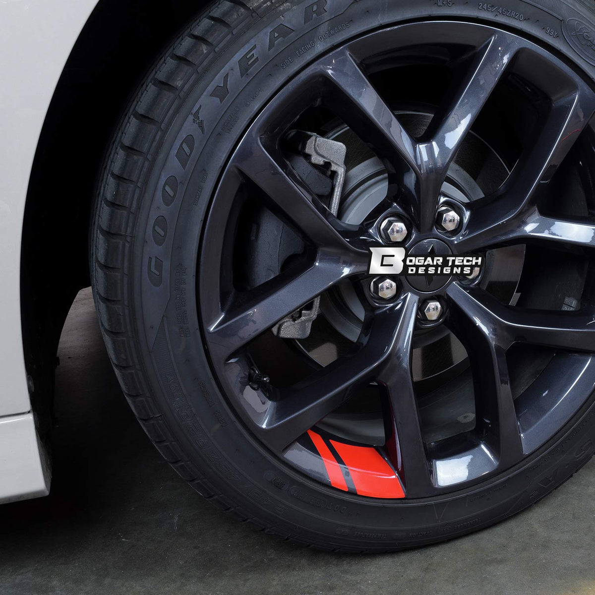 BOGAR TECH DESIGNS decal applied on an 18-inch wheel demonstrating immediate visual upgrade and road-ready fit
