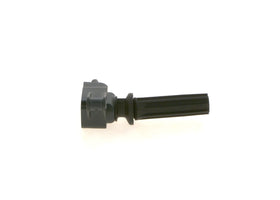 Bosch ignition coil installed in engine bay demonstrating direct-fit replacement ease