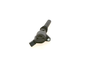 Bosch ignition coil installed in V8 engine demonstrating straightforward replacement advantage
