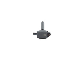 Mechanic replacing Bosch coil in garage illustrating easy installation benefit