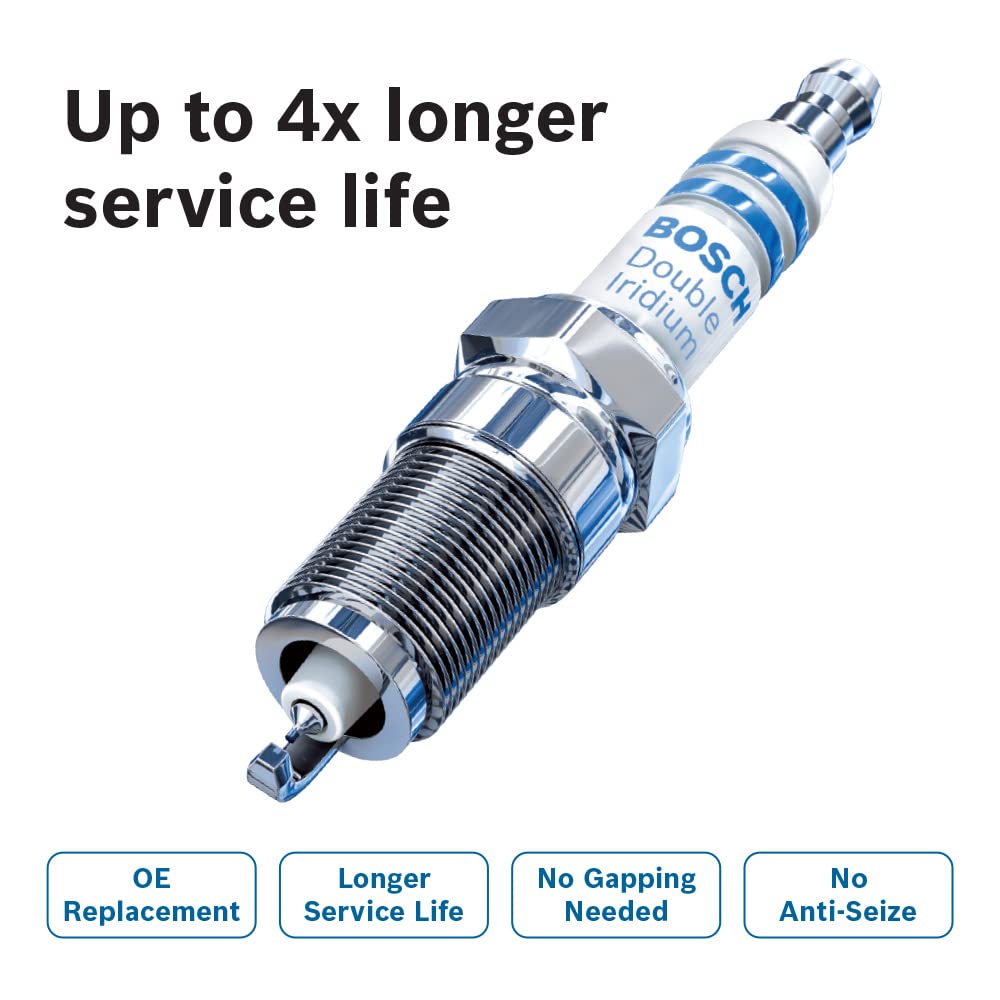 Bosch spark plugs on a workbench with tools showing easy-installation benefit