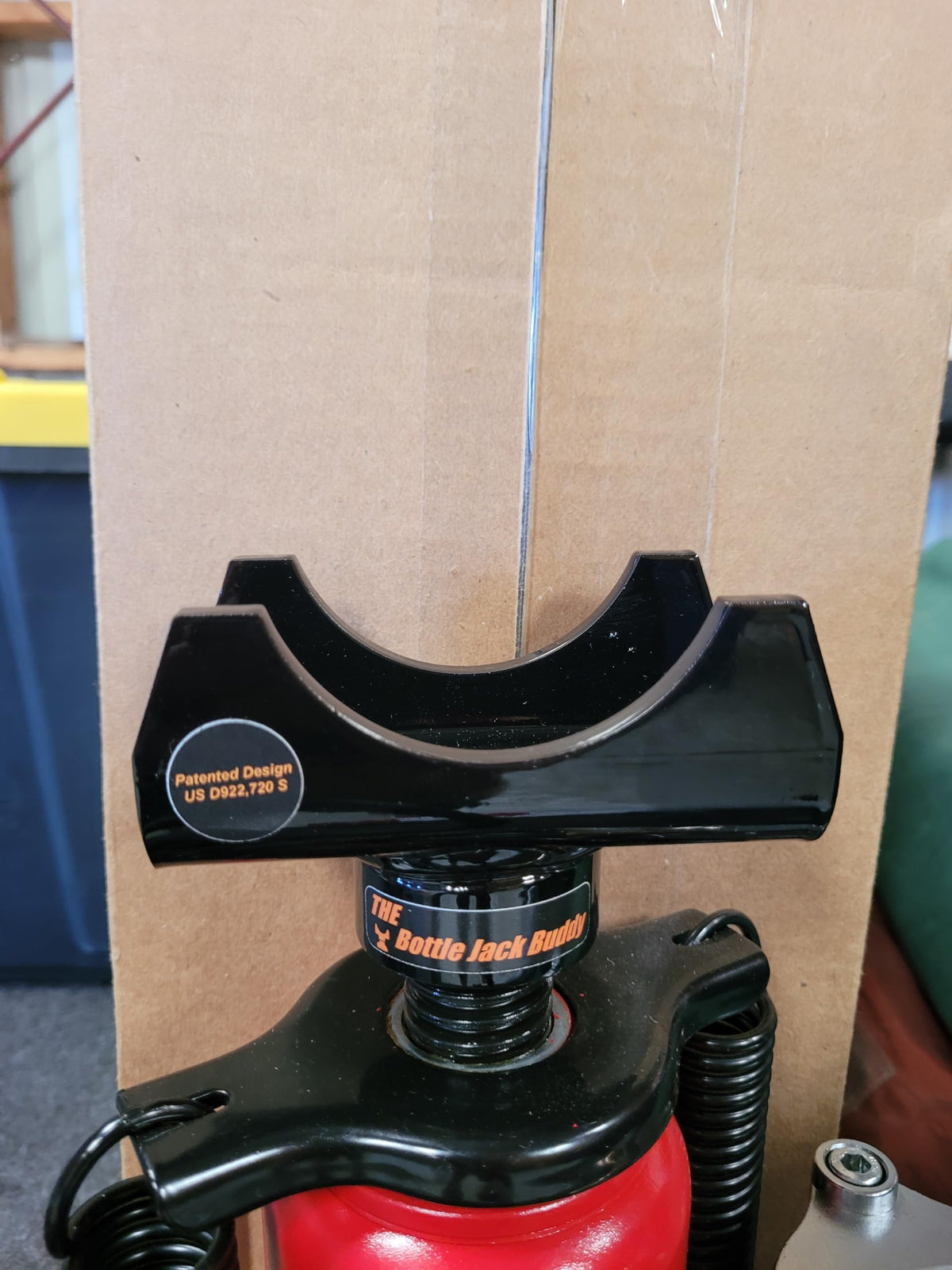 Bottle Jack Buddy mounted on a bottle jack demonstrating secure fit