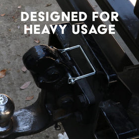 Boxer pins on a worksite with trailer and tools demonstrating durability