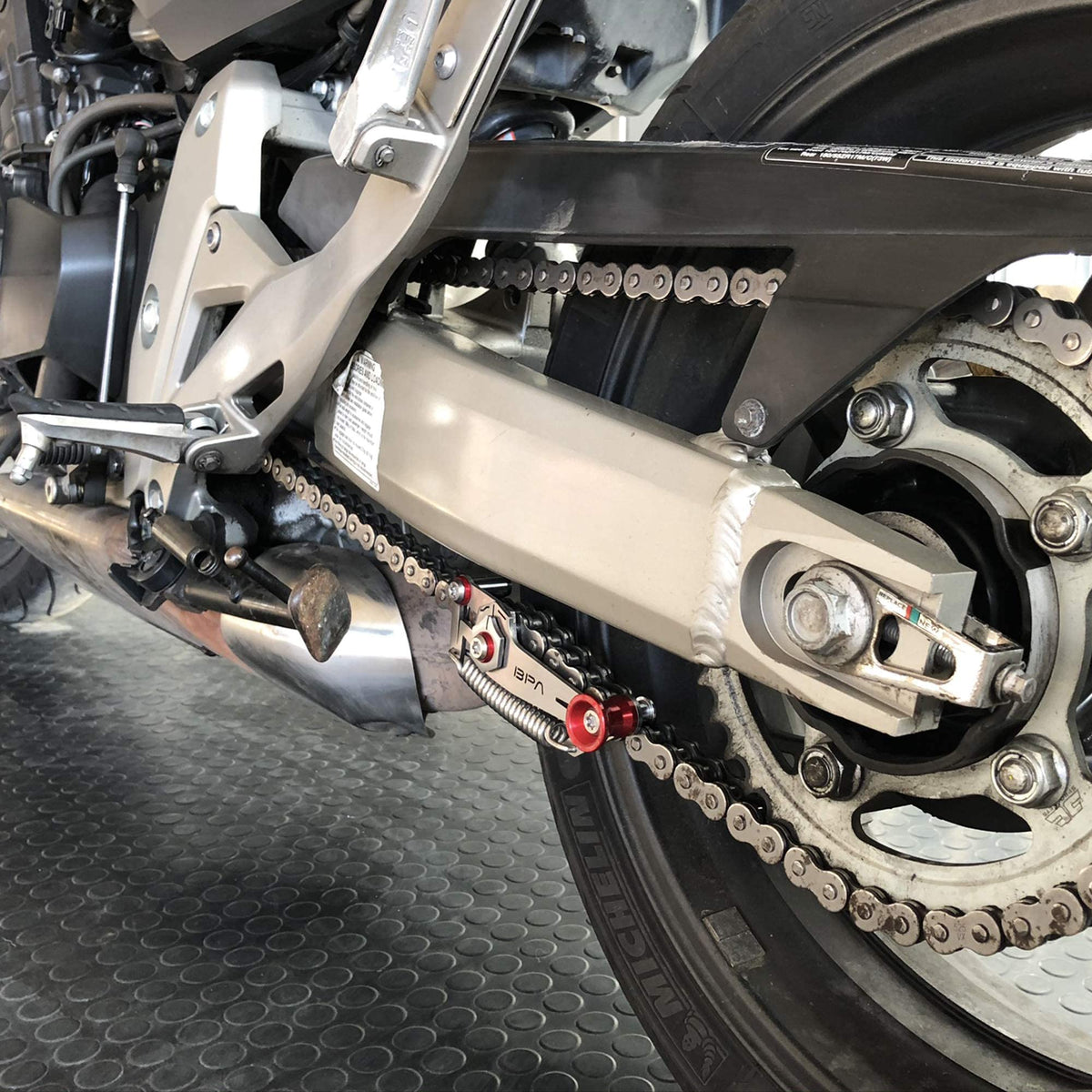 BPA-RACING in garage lifestyle shot, convenient easy chain adjustments
