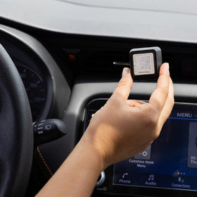 Bridgewater vent clip next to car keys to show compact size and easy portability