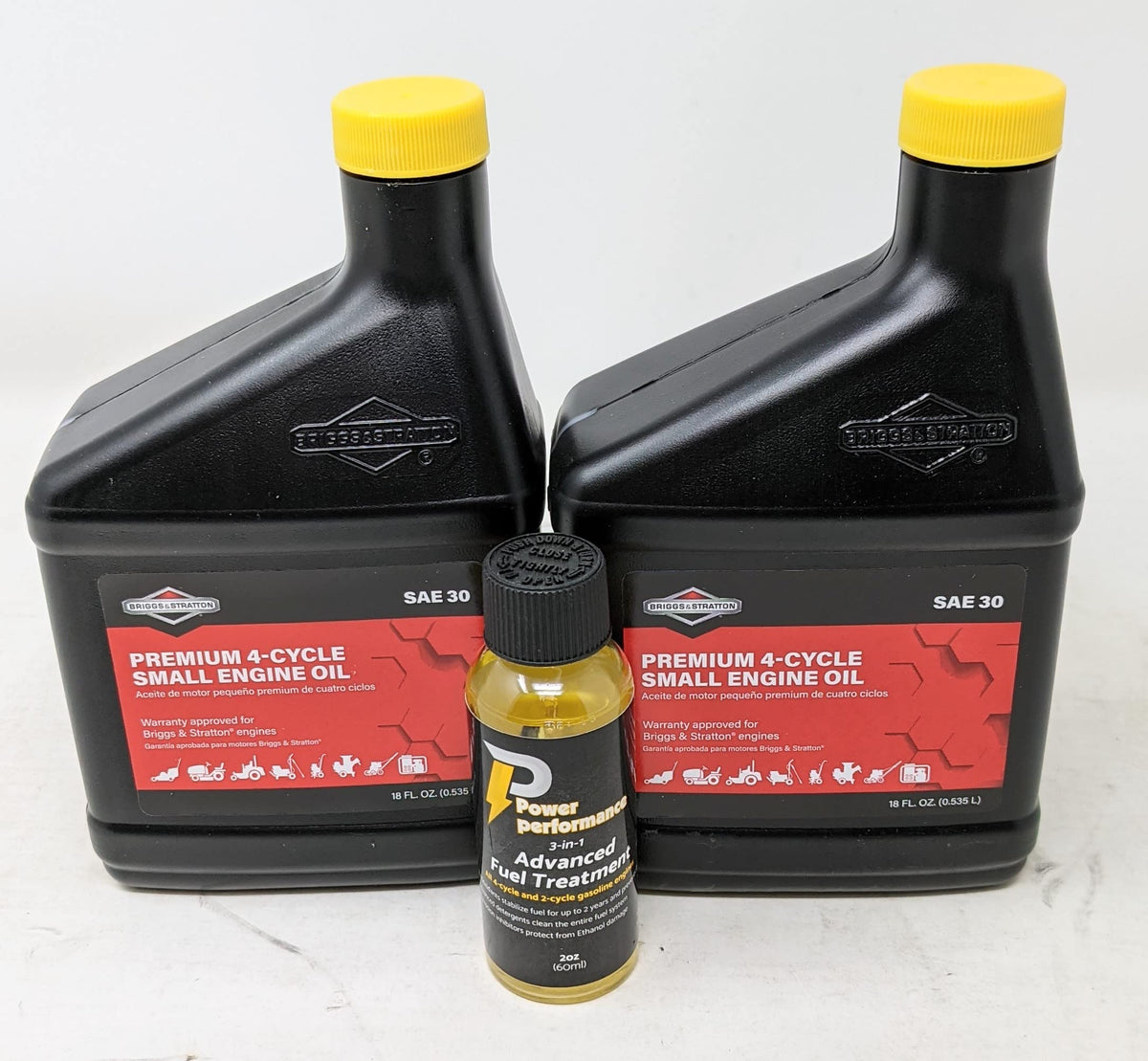 Briggs & Stratton front pack showing two 18oz oil bottles and fuel treatment benefits quick maintenance