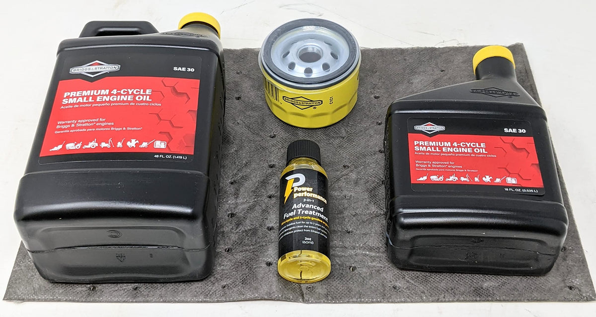Briggs & Stratton oil bottles closeup showing SAE 30 labels for correct viscosity