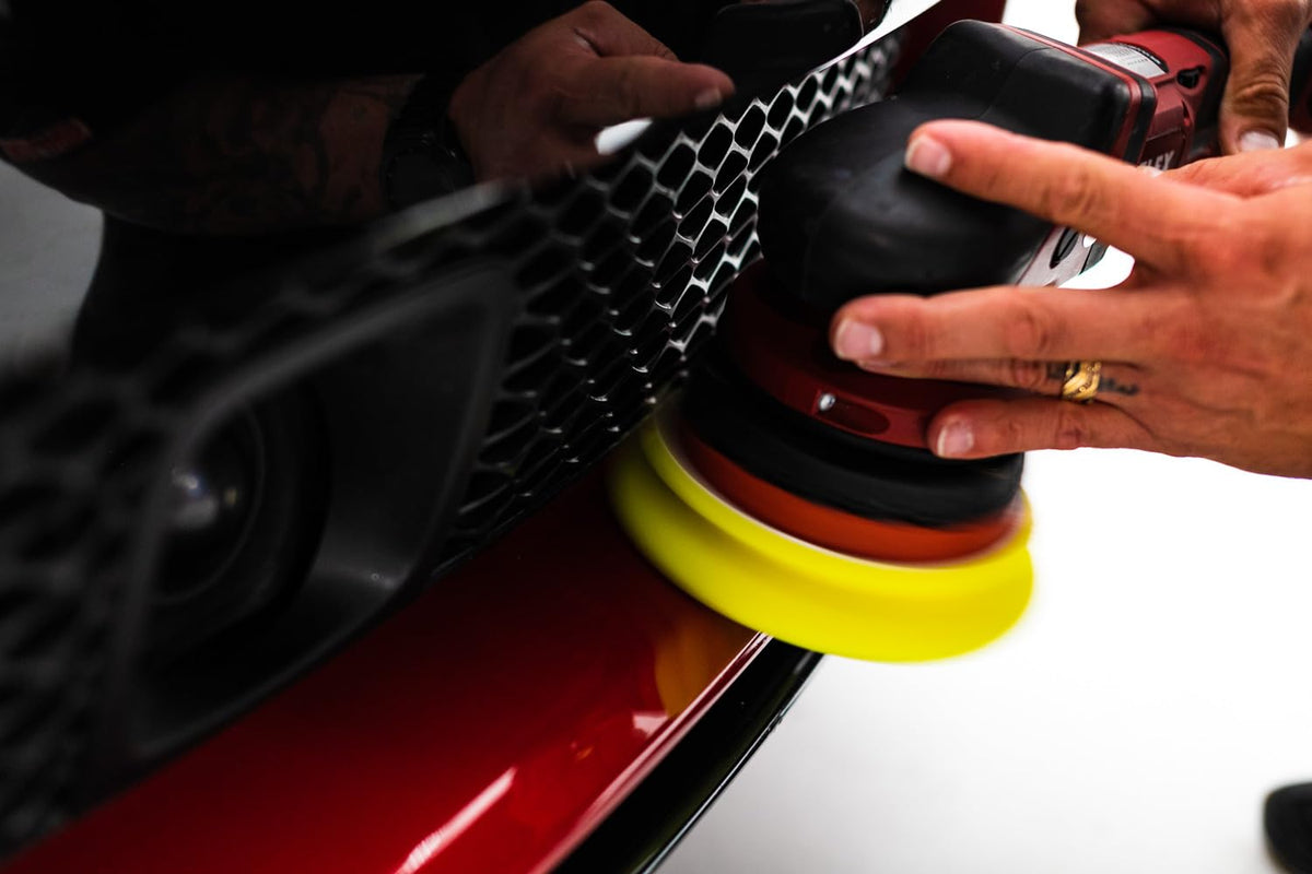 Buff and Shine pad held in hand to show 5-inch scale and comfortable handling benefit
