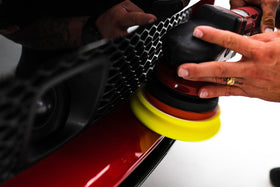 Buff and Shine pad held in hand to show 5-inch scale and comfortable handling benefit