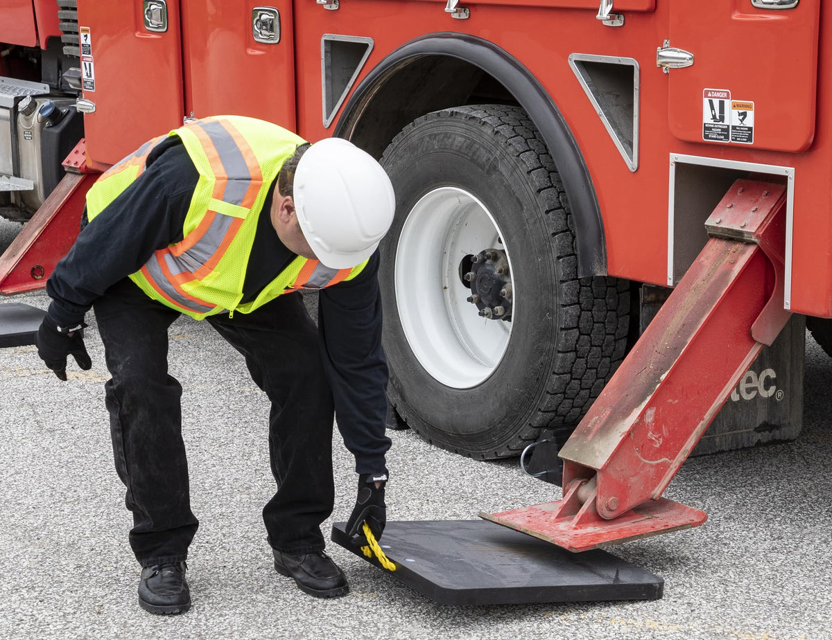 Buyers Products pad under truck outrigger demonstrating stability and surface protection