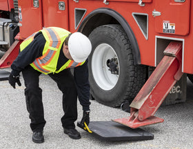 Buyers Products pad under truck outrigger demonstrating stability and surface protection