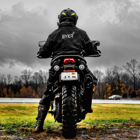 BYKR at campsite showing versatile rain protection for outdoor events