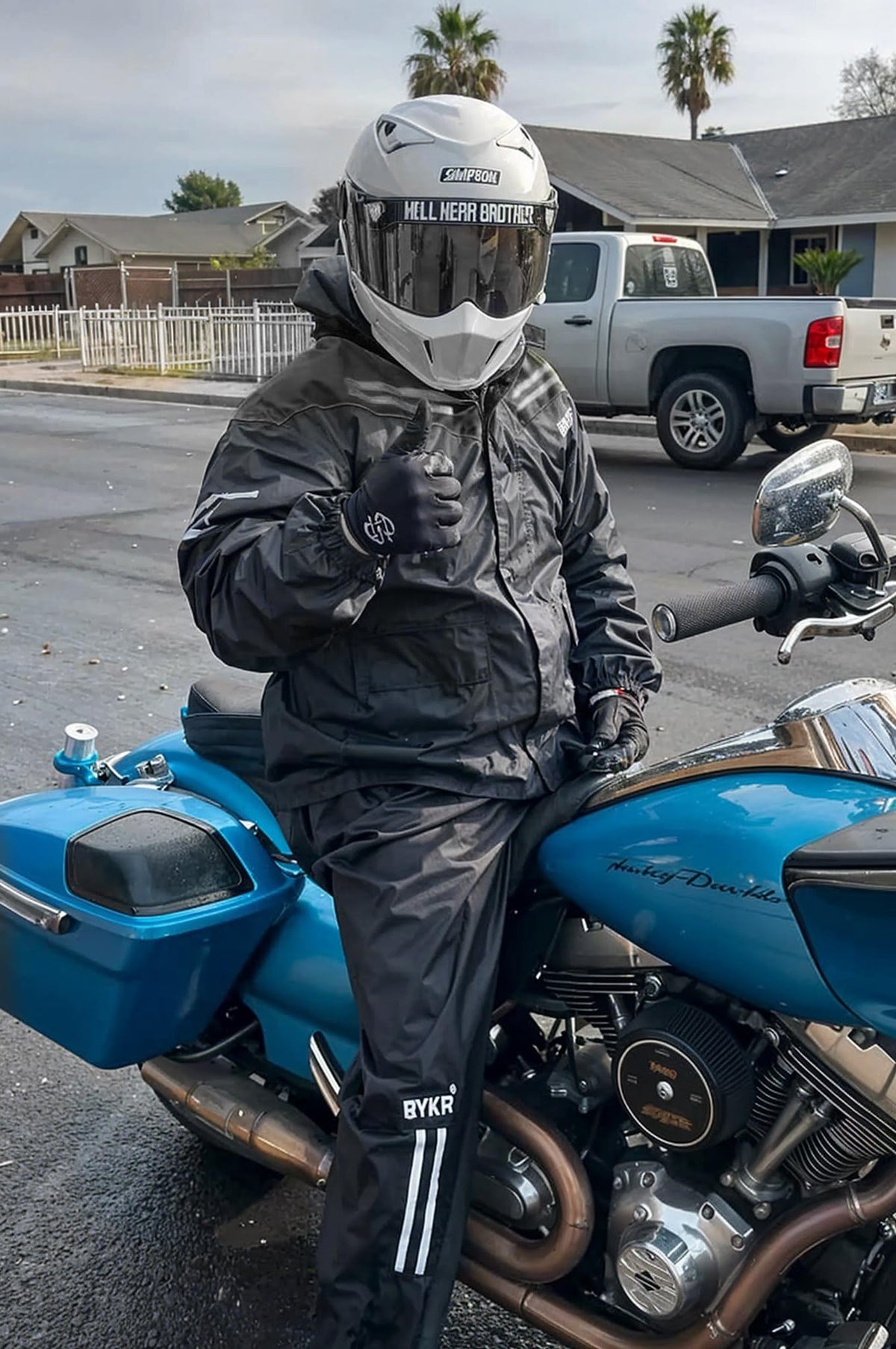 BYKR packable suit beside a water bottle for compact travel convenience