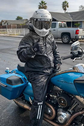 BYKR packable suit beside a water bottle for compact travel convenience