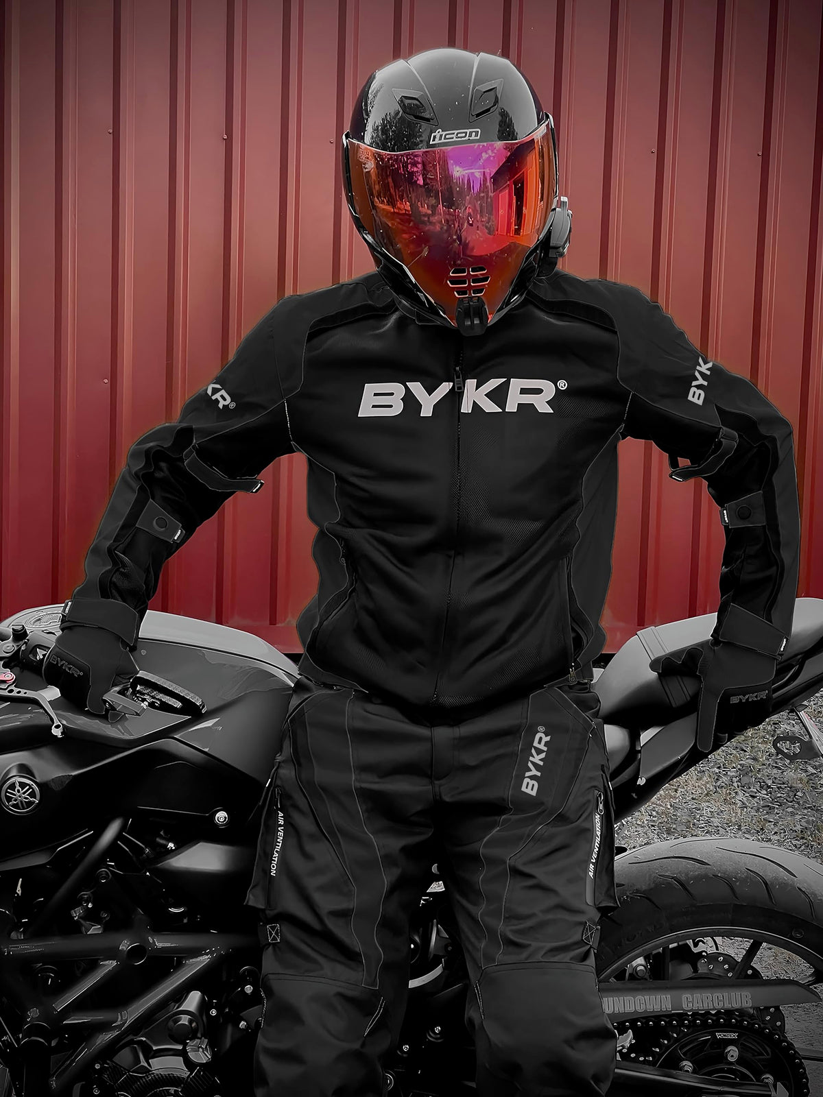 BYKR jacket next to helmet showing scale and coverage benefit