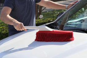 California Car Duster next to handrail for scale, clarifies overall 25" length