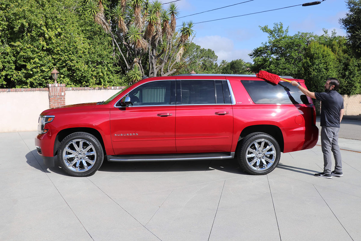 California Car Duster being used on an SUV roof for easier high-area cleaning