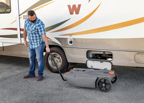 Camco 39011 size comparison with measuring tape showing compact footprint