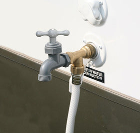 Camco faucet in use with hose showing kink-free hang and convenient outdoor water access