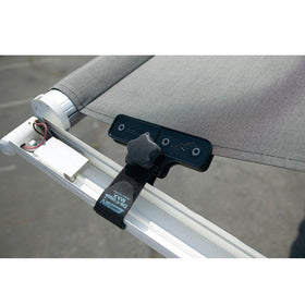 Camco clamp mounted on RV awning demonstrating reduced flapping and stability