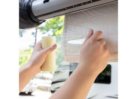 Camco tape next to ruler showing five-inch width for accurate planning