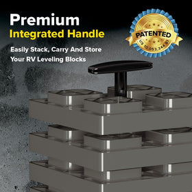 Camco leveling block placed under an RV wheel providing steady support on uneven ground