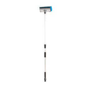 Camco brush being used on RV side showing efficient large-area cleaning