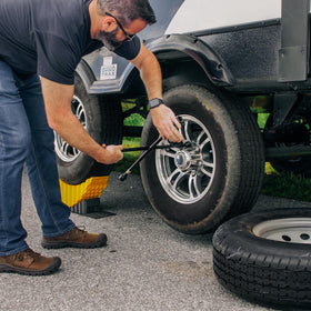 Camco curved trailer-aid rubber pad texture showing improved ground grip benefit