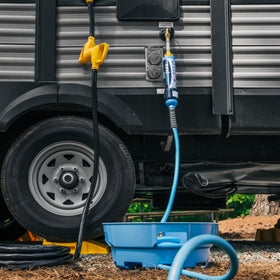 Camco EVOFlex beside measuring tape showing 35-foot scale