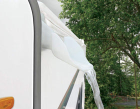 Camco spouts installed on RV drip rail directing water away and protecting side