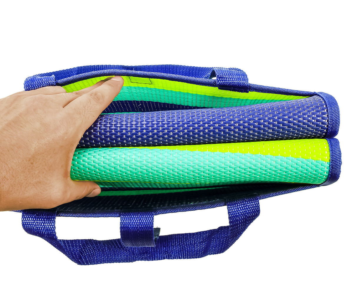 Camco handy mat stored with RV gear demonstrating compact fold fits camper storage benefit