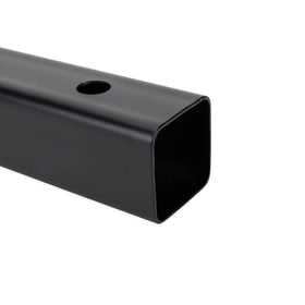 Camco holder next to tape measure showing size and compatibility benefit