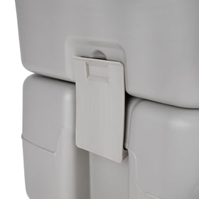 Camco portable toilet staged at a campsite offering hygienic convenience