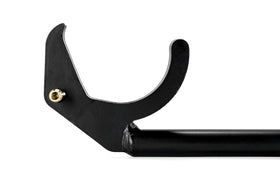 Camco tool in use lifting ReCurve spring bar onto hookup brackets for quicker, safer trailer setup