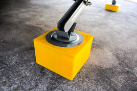 Camco cap under scissor jack demonstrating improved stability and safety