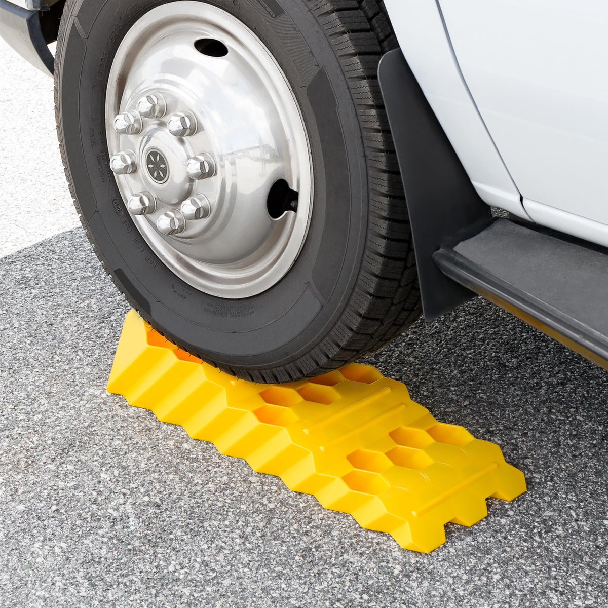 Camco in use with RV wheel on ramp for quick leveling
