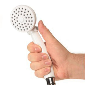 Camco shower head beside ruler showing dimensions and compact storage benefit