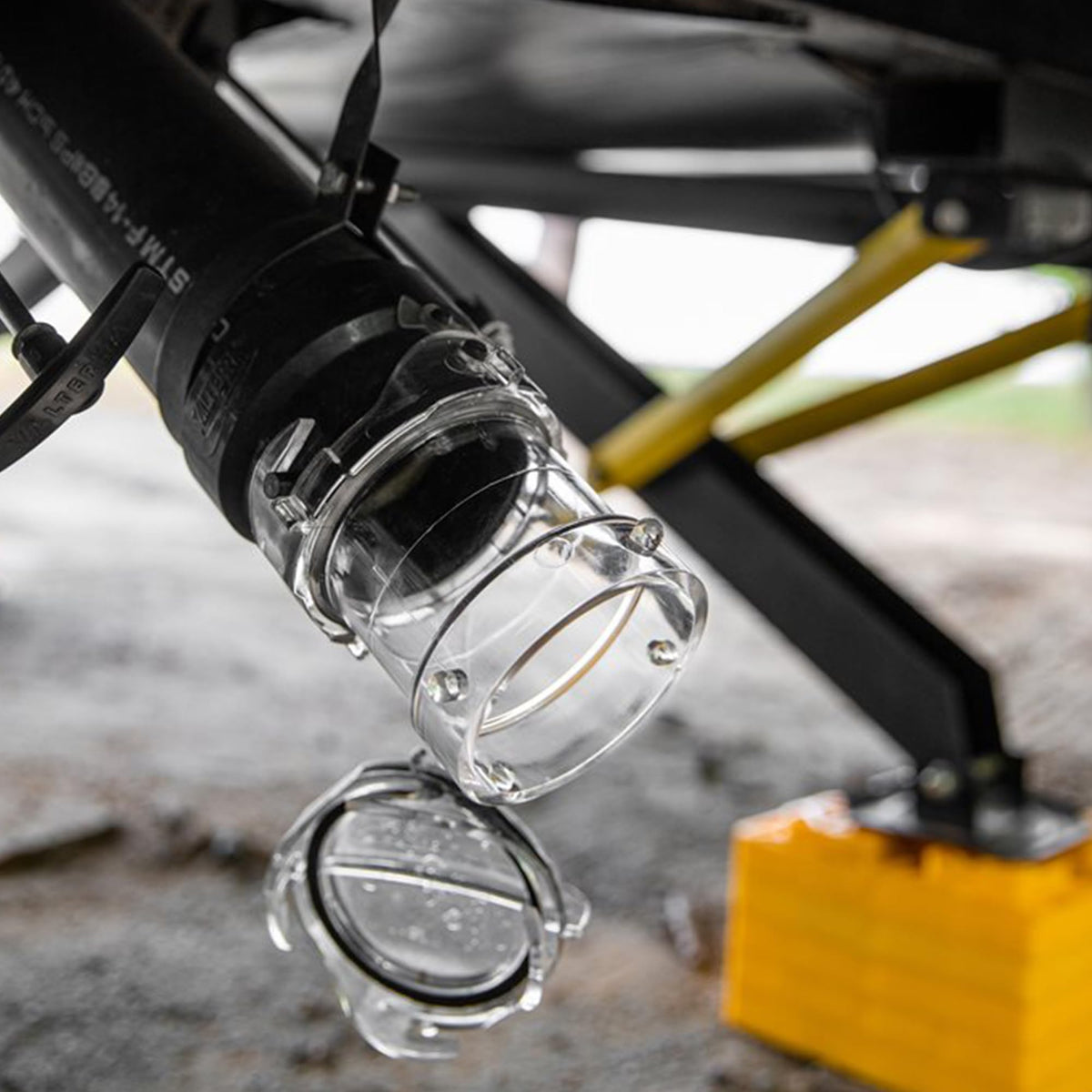 Camco packaged product shot showing included adapter ready for travel
