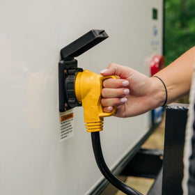 Camco PowerGrip connected to RV pedestal for dependable campsite power