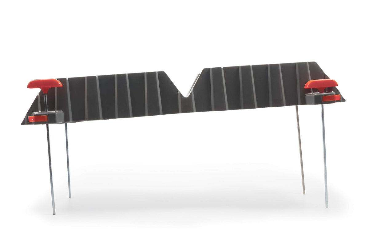 Camco on concrete pad showing stake-free use on hard surfaces benefit