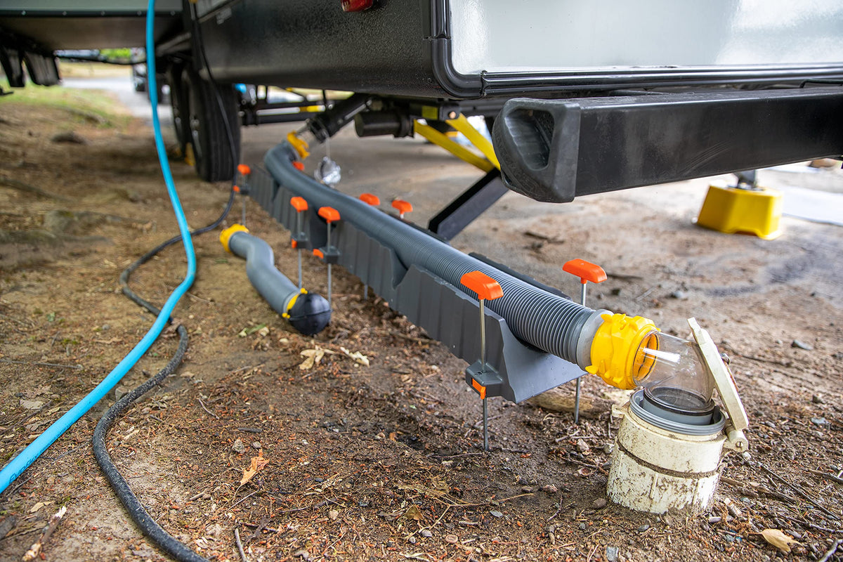 Camco in-use over curb demonstrating guided hose travel benefit