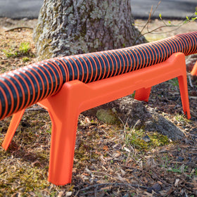 Camco Rhino installed at campsite illustrating tidy setup and hassle-free waste management benefit