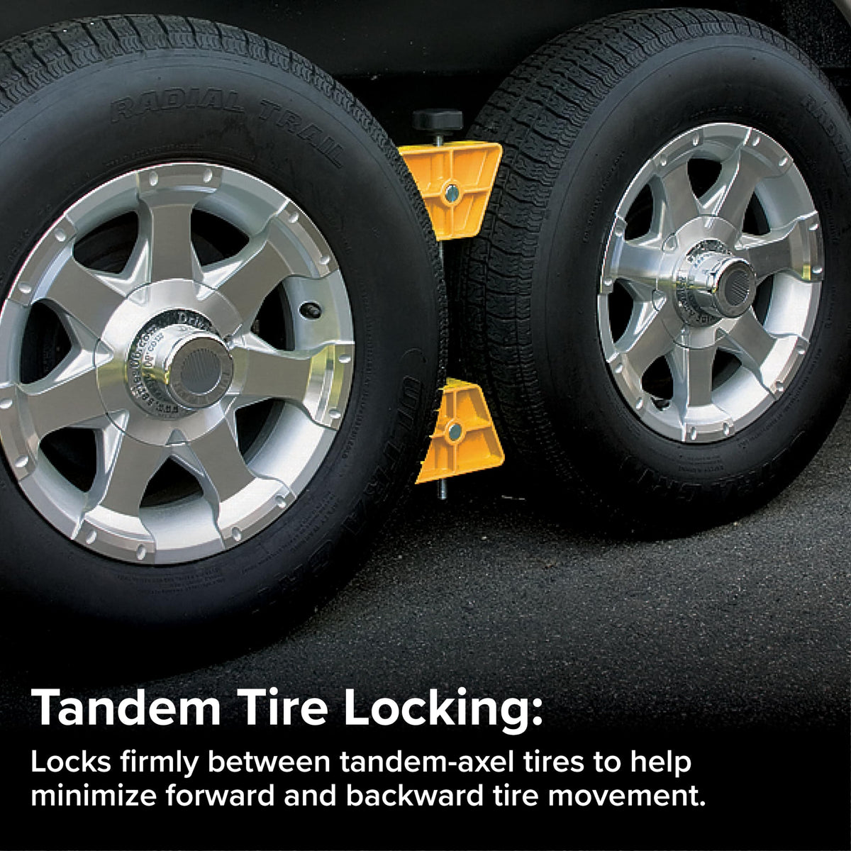 Camco wheel stop positioned between tandem tires reducing movement