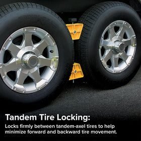 Camco wheel stop positioned between tandem tires reducing movement