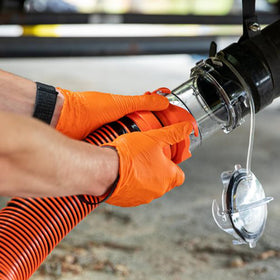 Camco adapter stored with sewer hose in compartment saving space and time