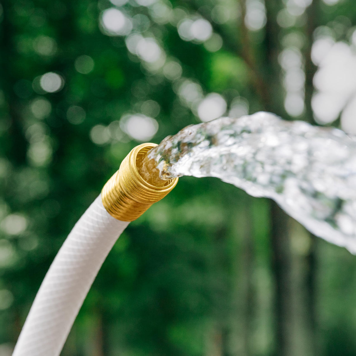 Camco TastePURE connected to RV spigot showing secure potable water delivery
