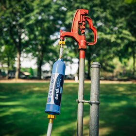 Camco hose in campsite setting providing safe water for outdoor activities