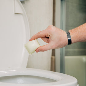 Close-up of a Camco TST Drop-IN pod highlighting pre-measured, mess-free use
